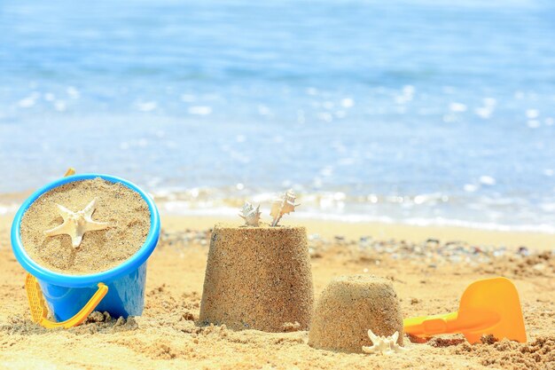 Composition with colorful toys on sea shore Vacation concept