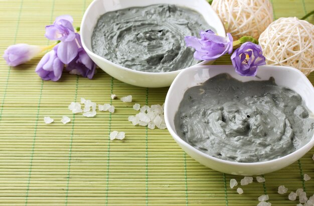 Composition with cosmetic clay for spa treatments on bamboo background