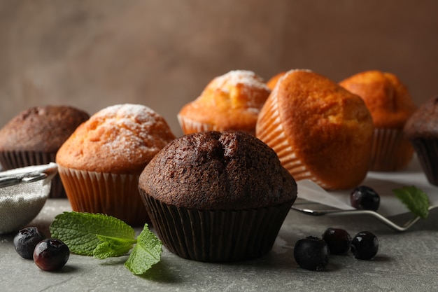 Composition with delicious muffins on gray