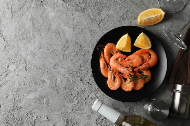 Composition with delicious shrimps on grey background, top view