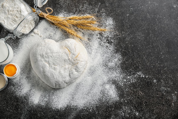 Composition with fresh raw dough on table