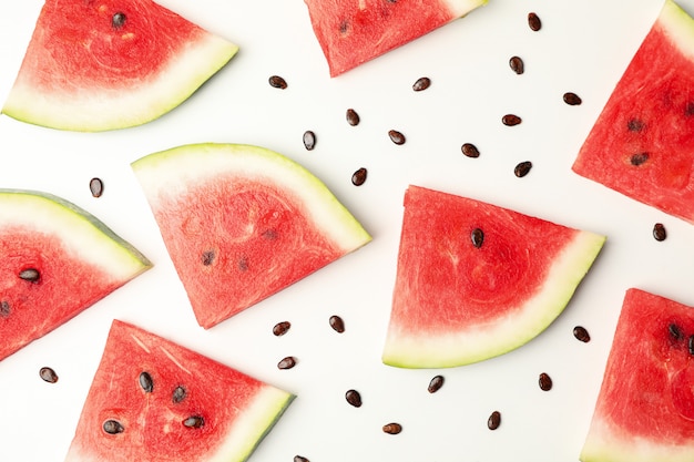 Composition with fresh watermelon slices on white