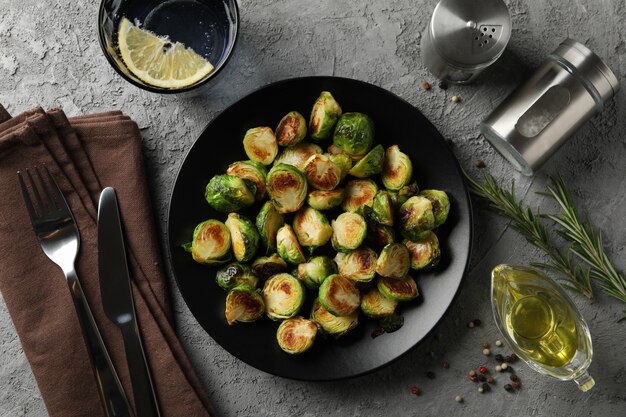 Composition with fried brussels sprout on grey surface