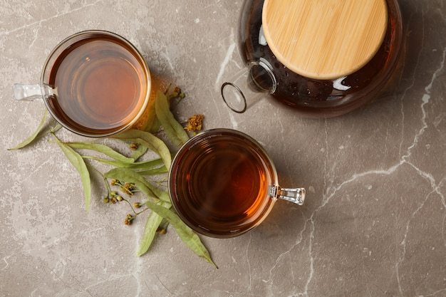 Composition with linden tea on gray, top view. Natural tea