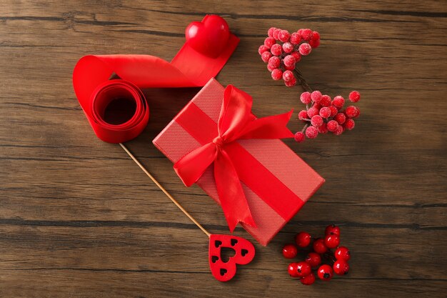 Composition with parcel gift box on wooden background