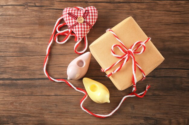 Composition with parcel gift box on wooden background