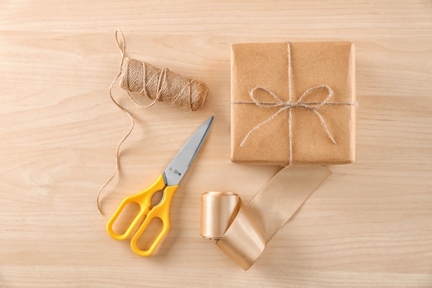 Composition with parcel gift box on wooden background