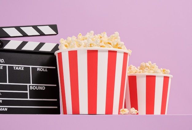 composition with popcorn and clapper movie enjoyment