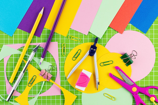 Composition with school stationery on color background