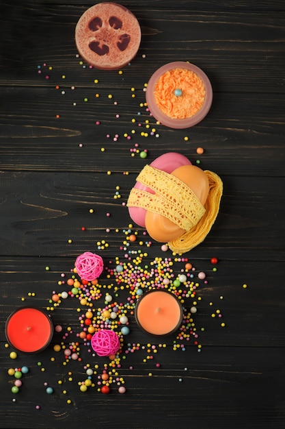 Composition with skin care products on a black wooden background