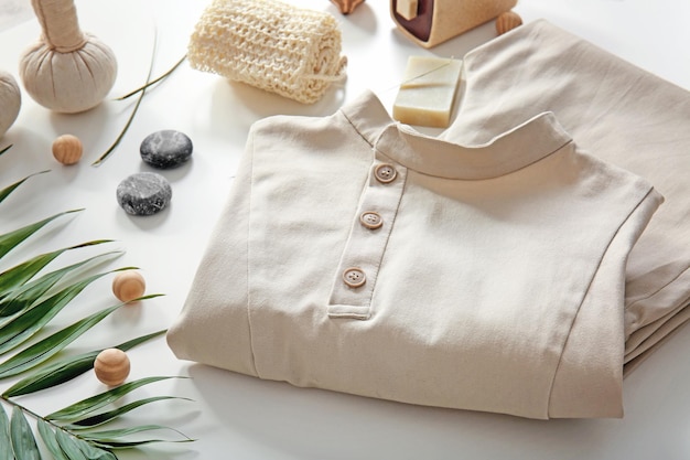 composition with spa uniform on white background