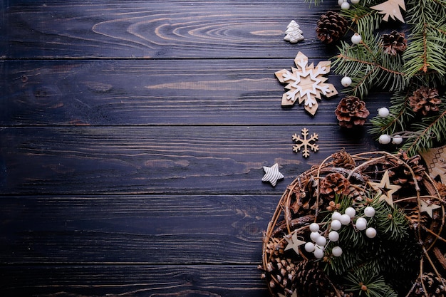 Composition with spruce branches on a wooden background