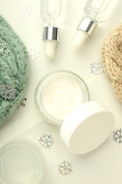 Composition with winter cosmetic products on white background