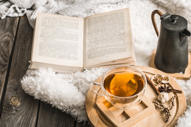 Composition with wooden letters and a Cup of tea