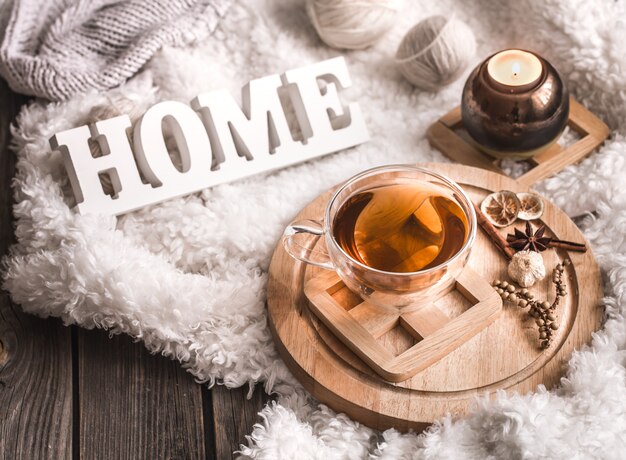 Composition with wooden letters and a Cup of tea