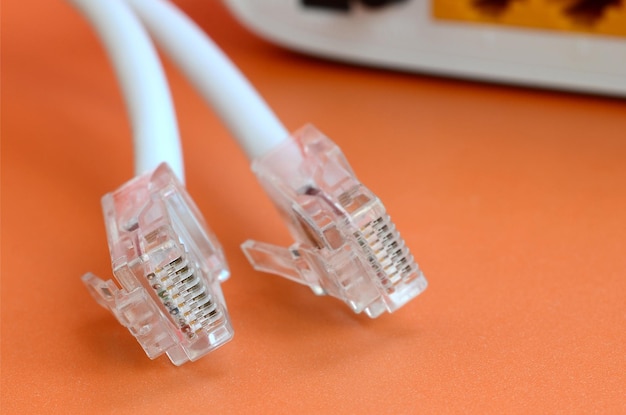 Computer cables and router on table