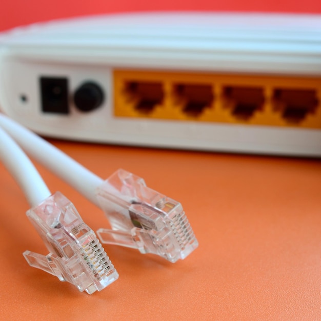 Computer cables and router on table