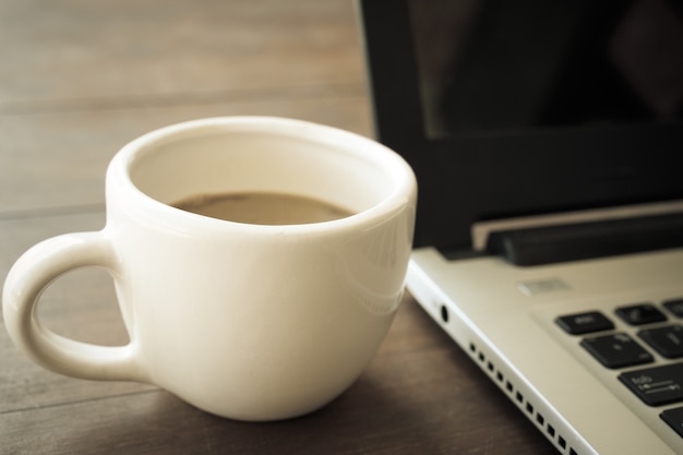 computer and coffee cup