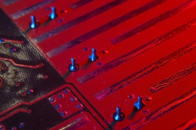 Computer cpu processor chip on circuit board motherboard background Closeup With redblue lighting