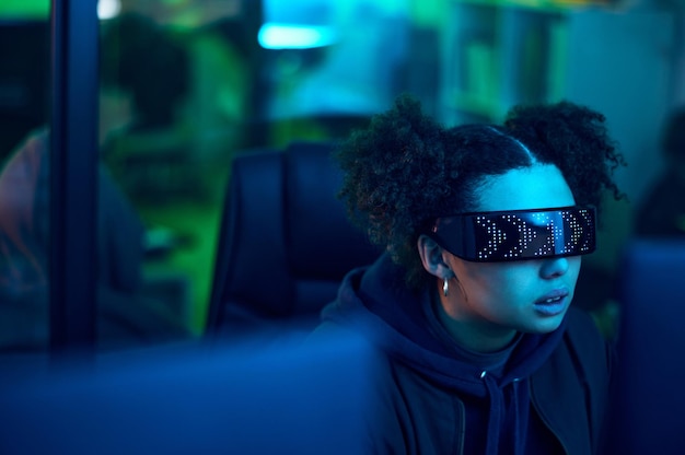 computer hacker cyberpunk and neon woman hacking software online server or programming password phishing blue ransomware developer cyber security glasses and night programmer coding malware code