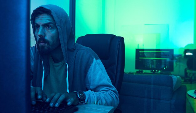 computer hacker software and neon man hacking online database website server or password phishing ransomware developer cyber security programming and blue programmer coding malware code at night