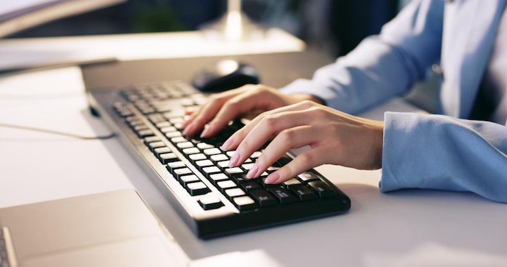 Photo computer hands and keyboard typing of a business woman coding for programmer code software analytics and database research of a seo web design developer working on ui digital search experience