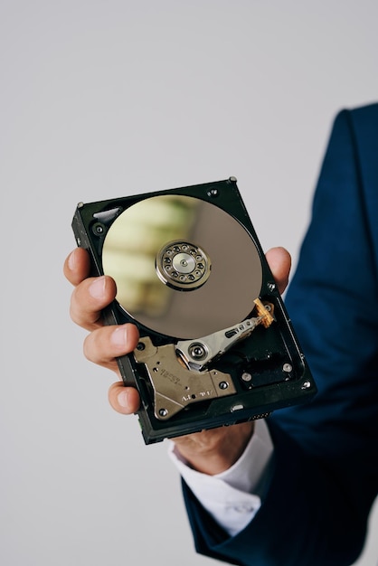 Computer hard drive in hands technology closeup