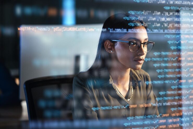 Photo computer hologram and woman coding for data analysis information technology overlay and night html programmer or it person in glasses reading software script programming or cybersecurity research