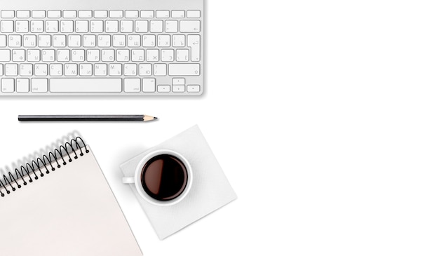 Computer keyboard at workplace and cup isolated on  background