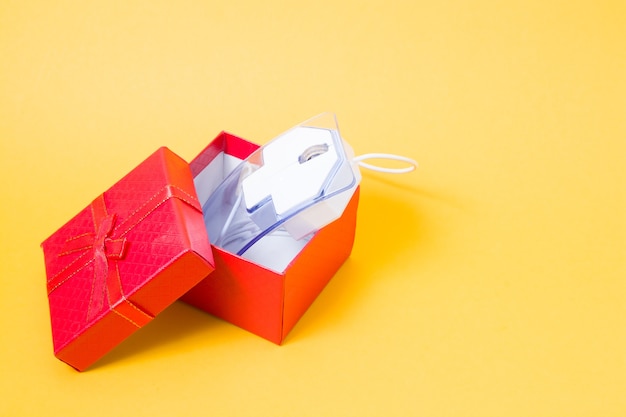 computer mouse with a red gift box