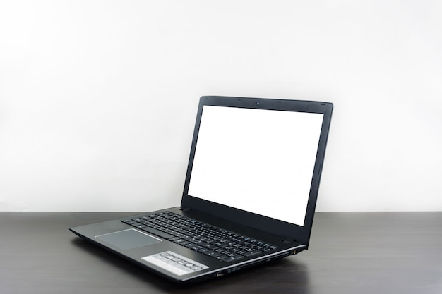 Computer notebook blank screen on wood table