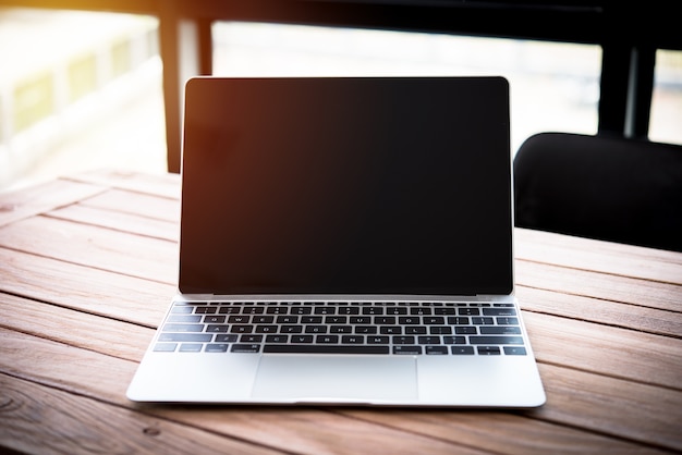 computer notebook on wood table