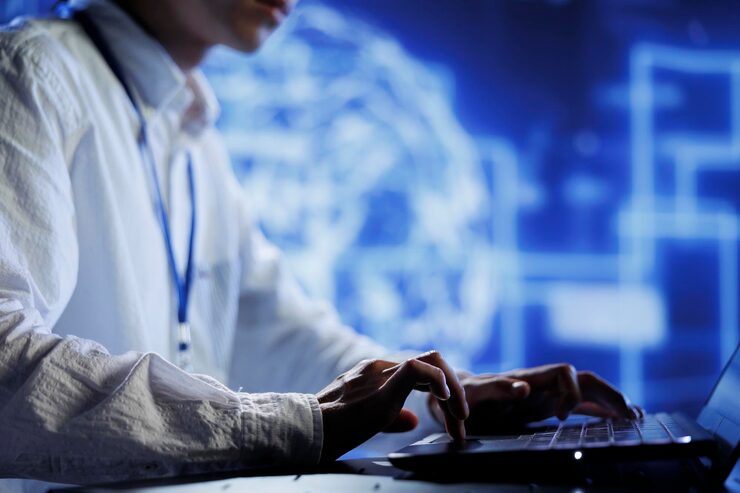 Photo computer operator in data center uses device for artificial intelligence computing simulating human brain through self learning algorithms. tech support working with ai deep neural networks