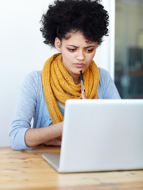 Photo computer pen and woman thinking in online education ideas and planning university college or school application decision choice and african person on laptop e learning web or internet research