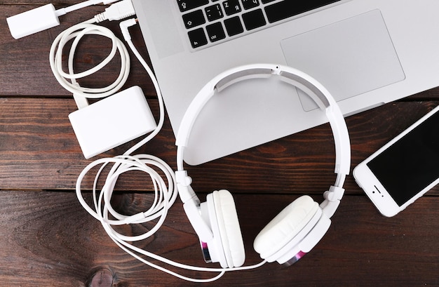 Computer peripherals and laptop accessories on wooden background