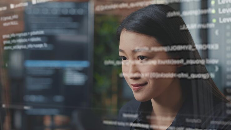 Photo computer scientist using ar technology to visualize script, writing code on computer screen while in office using javascript programming language. specialist working on fixing company servers errors