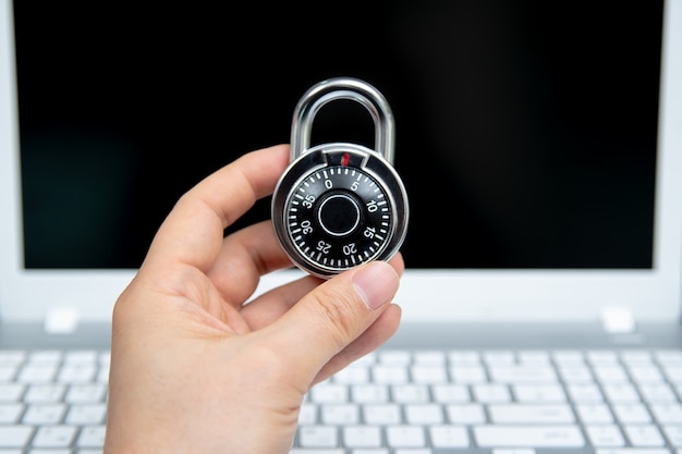 Computer security , padlock on laptop keyboard.