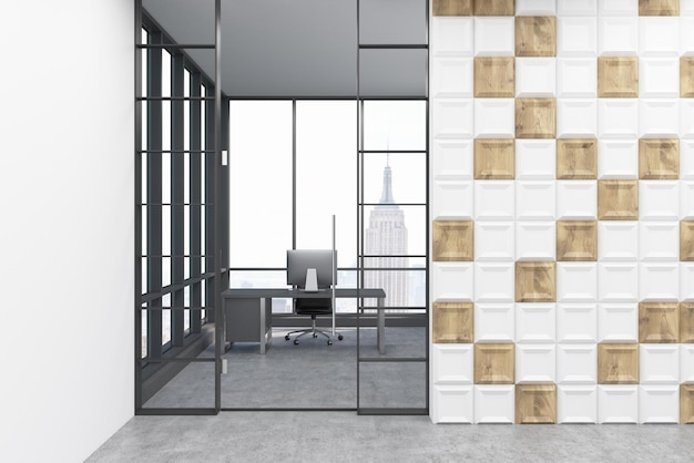 Computer on a table in white and wooden tiles room