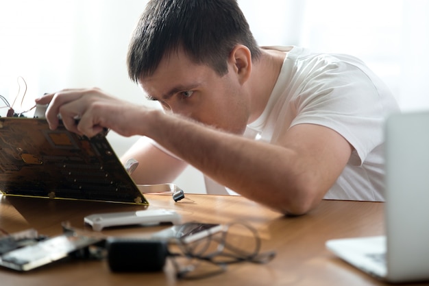 Computer technician repairing motherboard