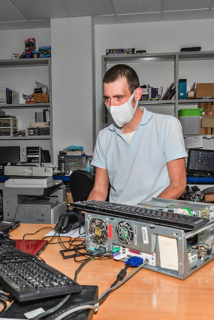 Computer technician working in workshop