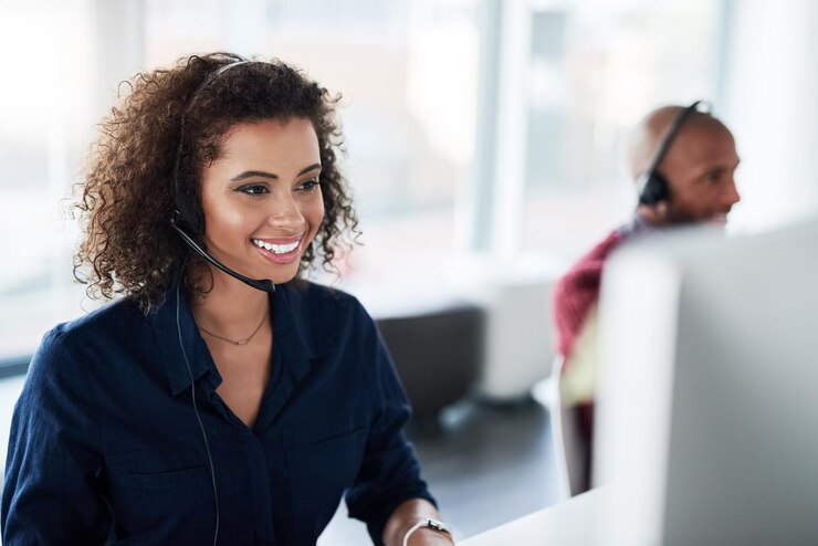 Photo computer virtual assistant or african woman in call centre telecom or tech support for customer care consultant telemarketing or happy inbound agent in agency with loan advice help or headset