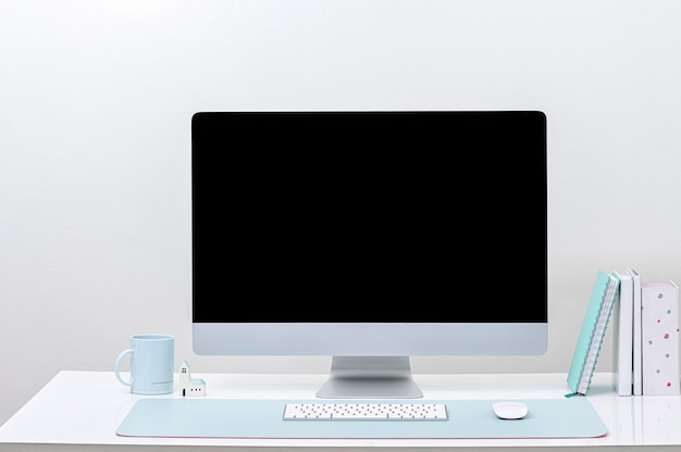 Photo computer with blank screen on a table