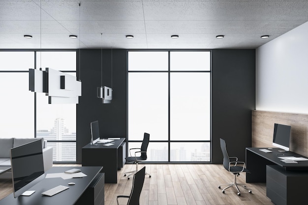 Computers on table in coworking office interior