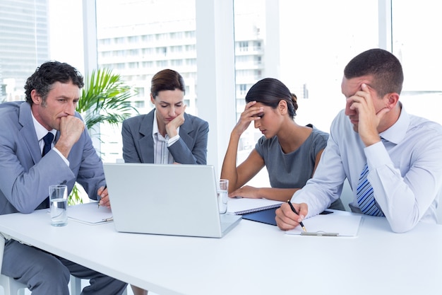 Concentrated business people in discussion in an office