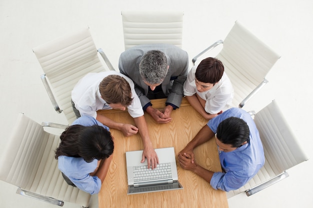 Concentrated business people using a laptop 