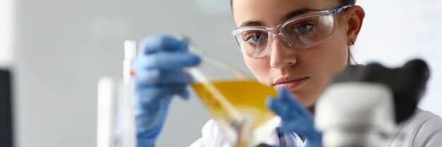 Concentrated female in white coat