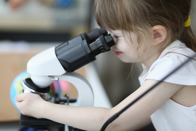 Concentrated girl in white shirt