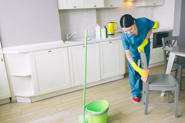 Concentrated and hard-working woman works in kitchen