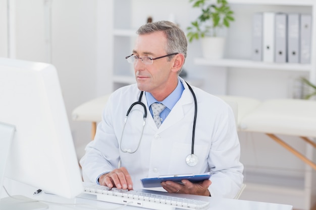 Concentrating doctor using computer 