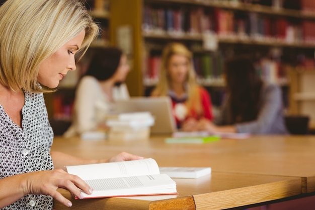 Concentrating mature student studying at desk